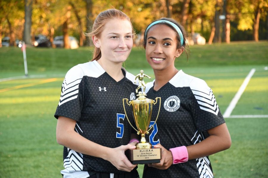 Senior Bri Astbury and Junior Kelly Beal pose with Preb B trophy on November 1 2019. (Photo/ PDS Flickr)