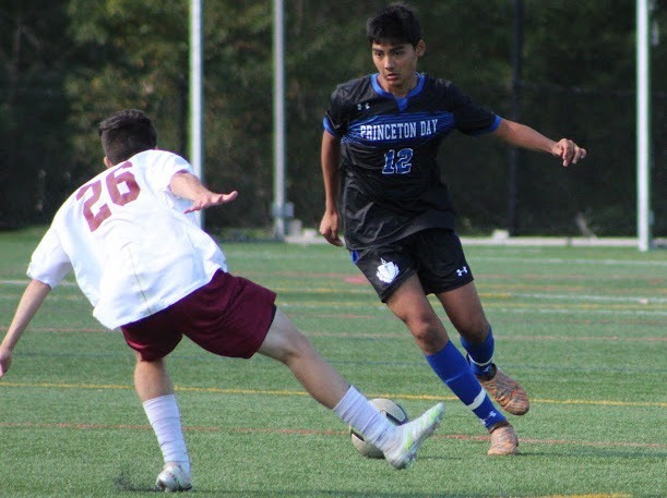 Junior Milan Shah faces off against opponent in the Boys Varsity Soccer game on 10/3. (Photo/Darby McChesney)